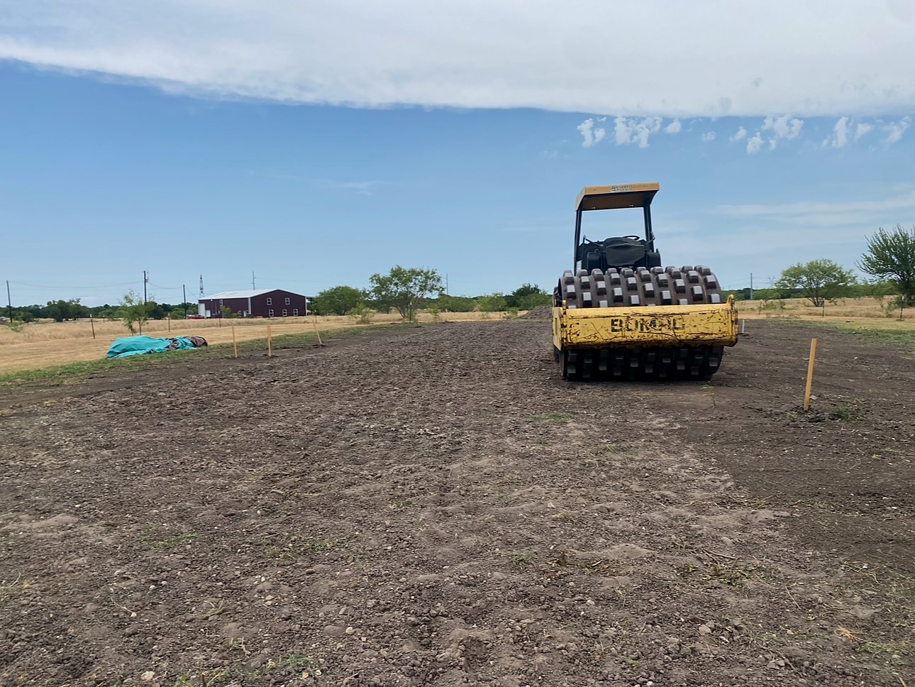 BOMAG padfoot roller compacting a house pad