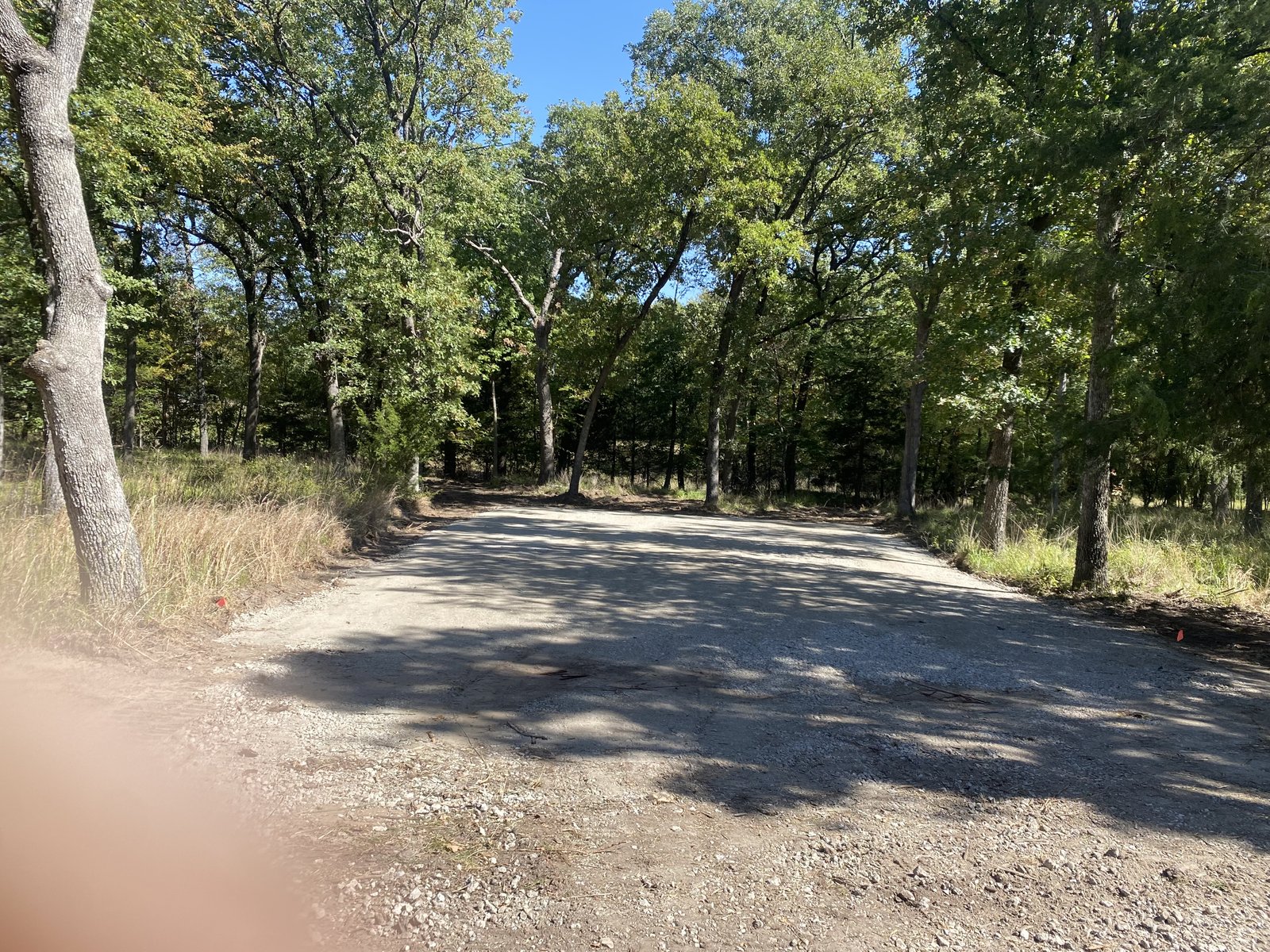 Rectangular gravel pad cleared in the woods